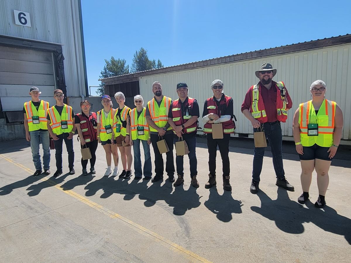 Some of the tour members outside holding gift bags from Farmers Fresh